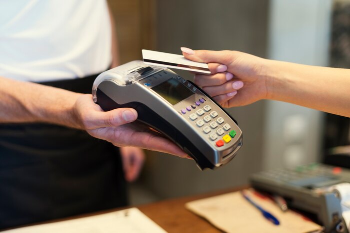Close up of customer paying by credit card